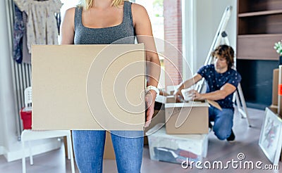 Woman carrying moving box Stock Photo