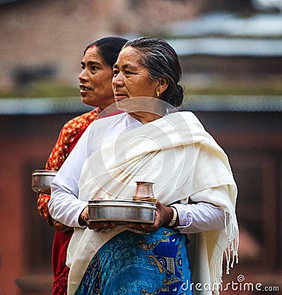 Woman carrying offerings Nepal Editorial Stock Photo