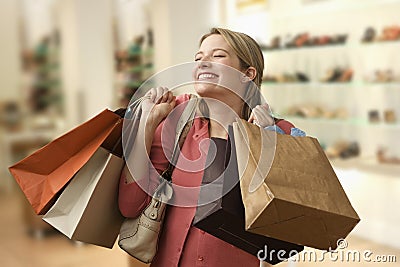 Woman Carrying Shopping Bags Stock Photo