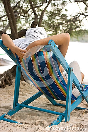 Woman in chaise longue Stock Photo