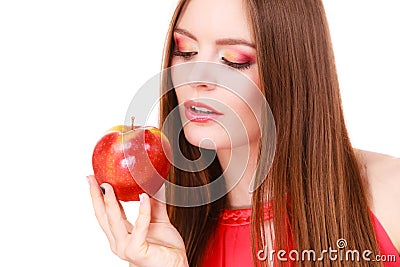 Woman charming girl colorful makeup holds apple fruit Stock Photo