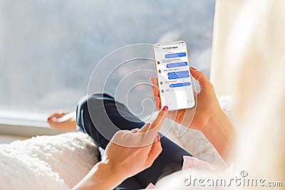Girl chatting with friend on mobile phone. Stock Photo