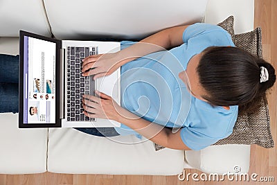 Woman Chatting On Social Networking Site Stock Photo