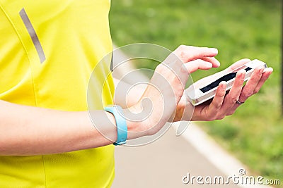 Woman checking fitness and health tracking wearable device Stock Photo