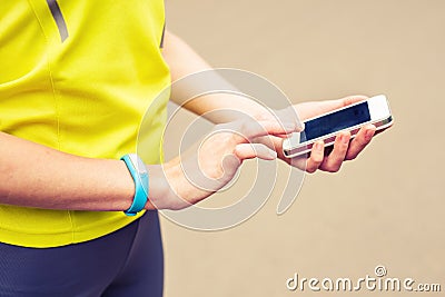 Woman checking fitness and health tracking wearable device Stock Photo