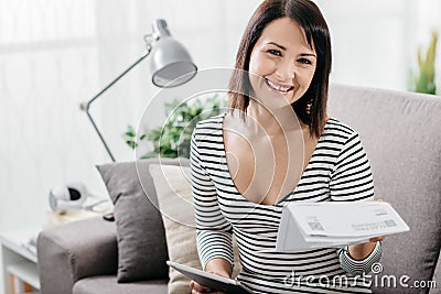 Woman checking household bills Stock Photo