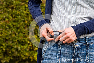 Woman checking pedometer Stock Photo