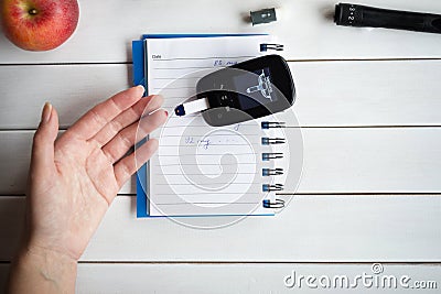 Woman checking sugar level with glucometer. Diabetes test. Healthcare, diabetes, medical concept. Stock Photo