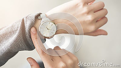 Woman checking time her watch Stock Photo