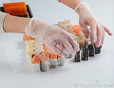 Woman chef prepares seafood in the restaurant. Stock Photo