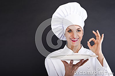 Woman cheff over dark backgrund Stock Photo