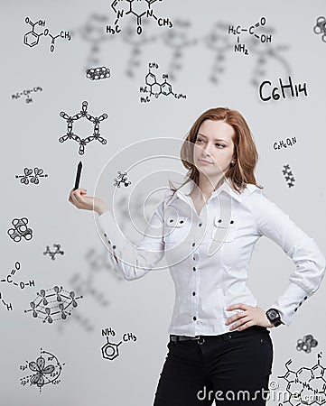 Woman chemist working with chemical formulas on grey background Stock Photo