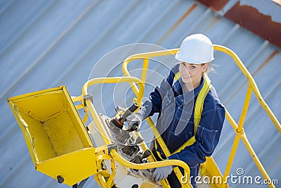 Woman in cherry picker bucket Stock Photo