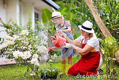 Woman and child gardening. Grandmother and kid Stock Photo