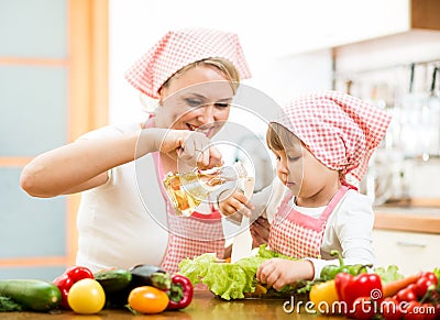 Woman and child preparing healthy food together Stock Photo