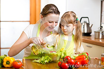 Woman and child preparing healthy food together Stock Photo