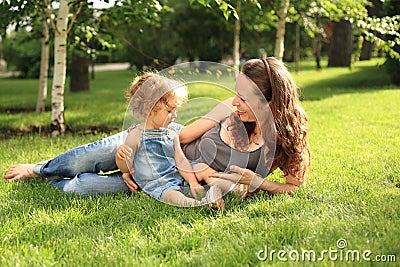 Woman with child in summer park Stock Photo