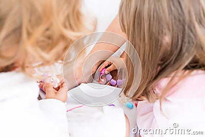 Woman and children on bed Stock Photo