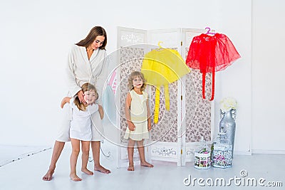 Woman and children in bedroom Stock Photo