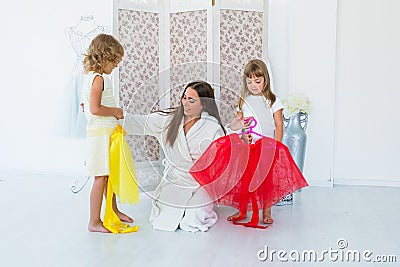 Woman and children in bedroom Stock Photo