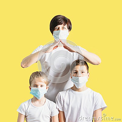 Woman children boy girl in medical masks for protection against coronovirus disease. Concept for stopping the Covid 19 Stock Photo