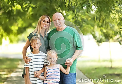 Woman with children and elderly father Stock Photo