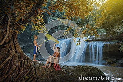 Woman and children playing the water Stock Photo