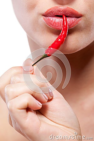 Woman with chili pepper on white Stock Photo