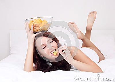 Woman with chips Stock Photo