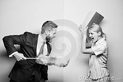 Woman choose to work digital technology. Man force girl to clean up. Gender inequality start from household. Gender Stock Photo