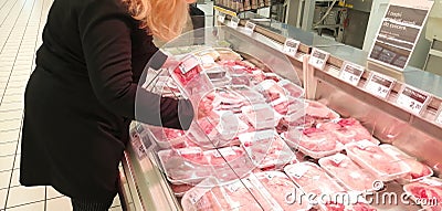 Woman chooses meat Stock Photo