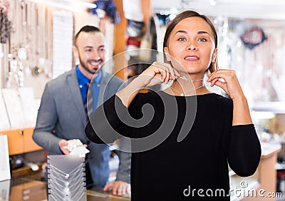 woman choosing chainlet and pendants Stock Photo