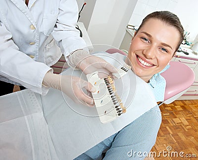 Woman choosing denture Stock Photo