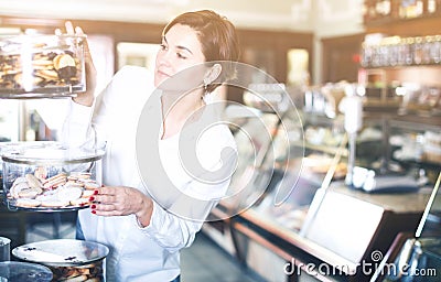 Woman choosing dessert Stock Photo