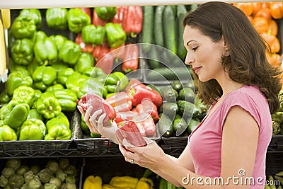 Woman choosing fresh produce Stock Photo