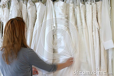 Woman choosing a wedding dress Stock Photo