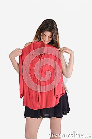 Woman choosing which clothes to wear Stock Photo
