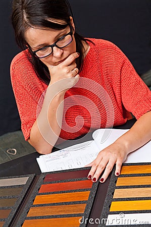 Woman choosing wood color Stock Photo