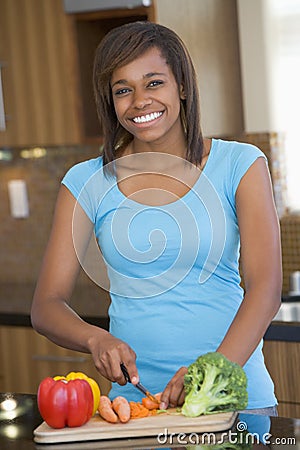 Woman Chopping Vegetables Stock Photo