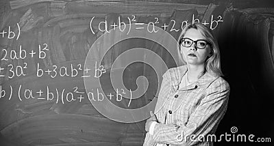 Woman in classroom. teacher on school lesson at blackboard. Back to school. Teachers day. Study and education. Modern Stock Photo