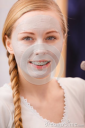 Woman with clay mud mask on her face Stock Photo