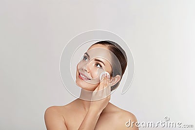 Woman Cleaning Face With White Pad. Beautiful Girl Removing Makeup White Cosmetic Cotton Pad. Happy Smiling Female Taking Off Make Stock Photo