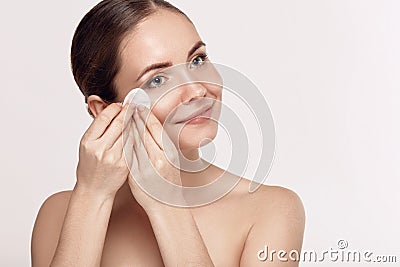 Woman Cleaning Face With White Pad. Beautiful Girl Removing Makeup White Cosmetic Cotton Pad Stock Photo