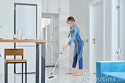 Woman cleaning her flat with mop Stock Photo