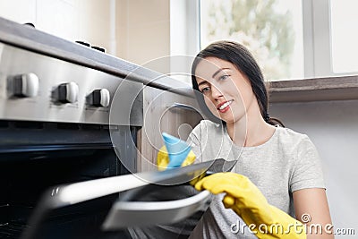 Woman cleaning kitchen Stock Photo