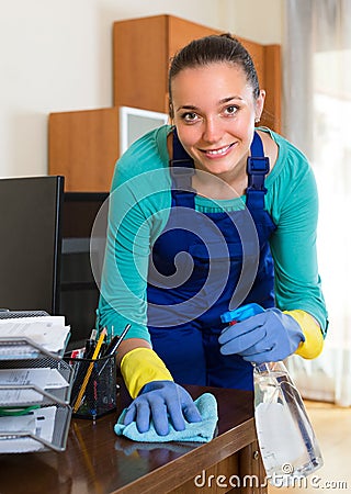 Woman cleaning office room Stock Photo