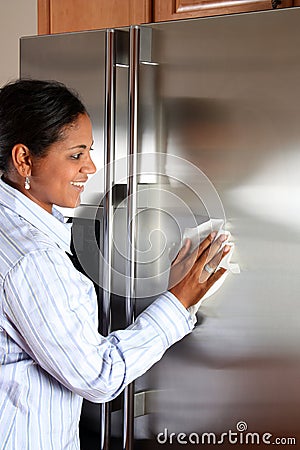 Woman Cleaning Refrigerator Stock Photo