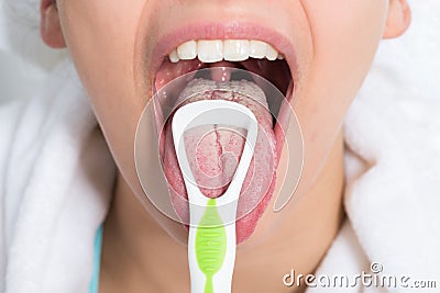 Woman Cleaning Tongue Stock Photo