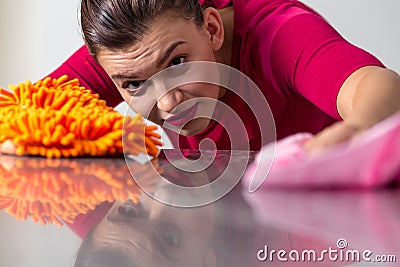 Woman cleaning a worktop Stock Photo