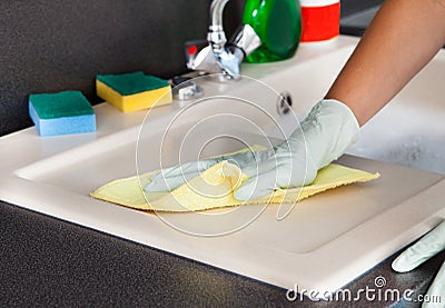 Woman Cleaning Worktop Stock Photo